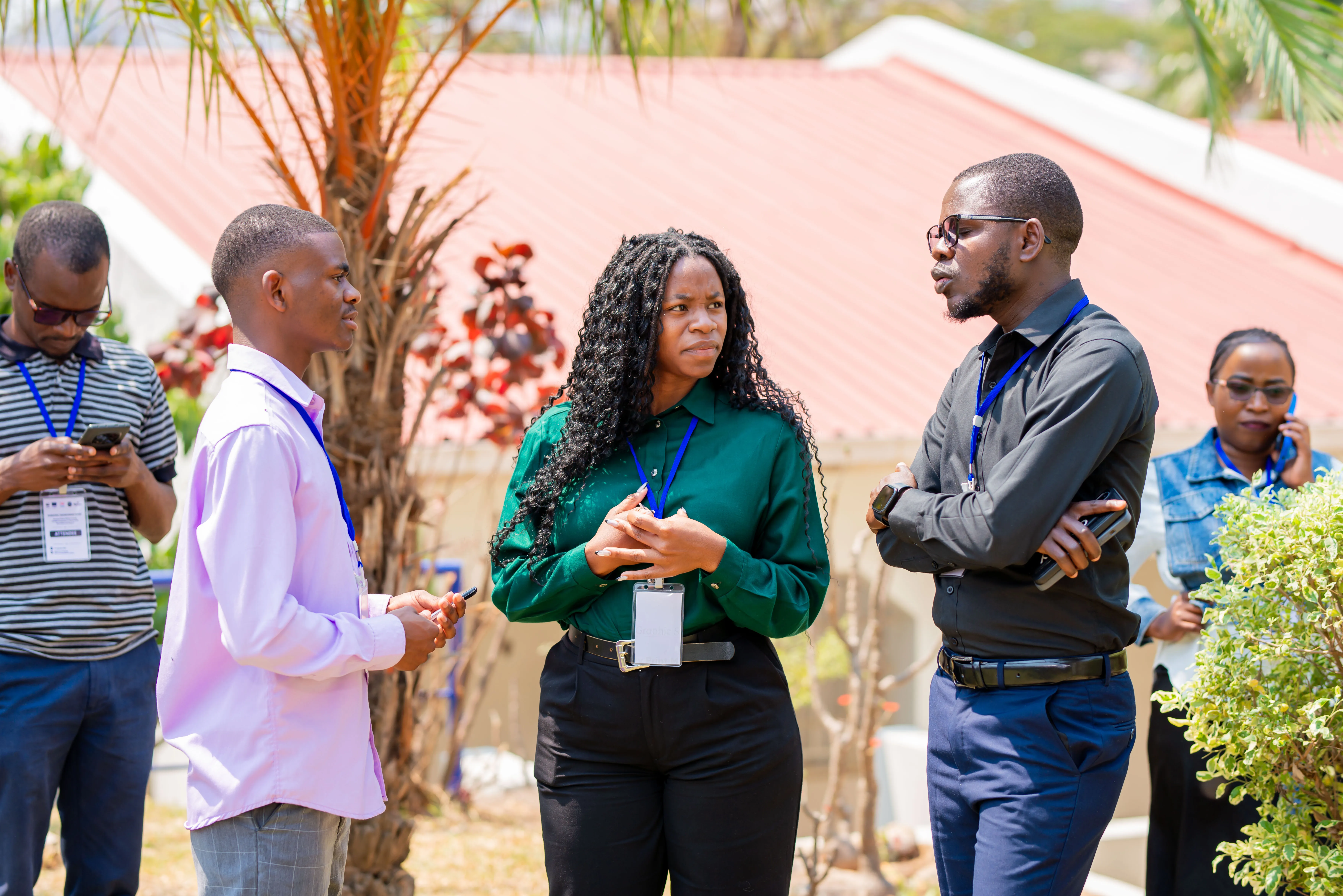 three people captured having a discussion